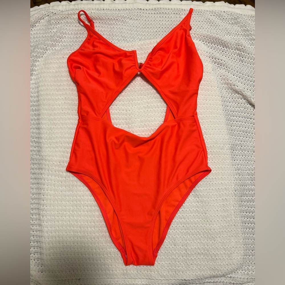 Xhiliration brand one piece cut out bathing suit. Size L